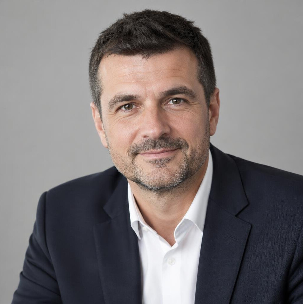 Portrait of a businessman in a suit with a warm smile