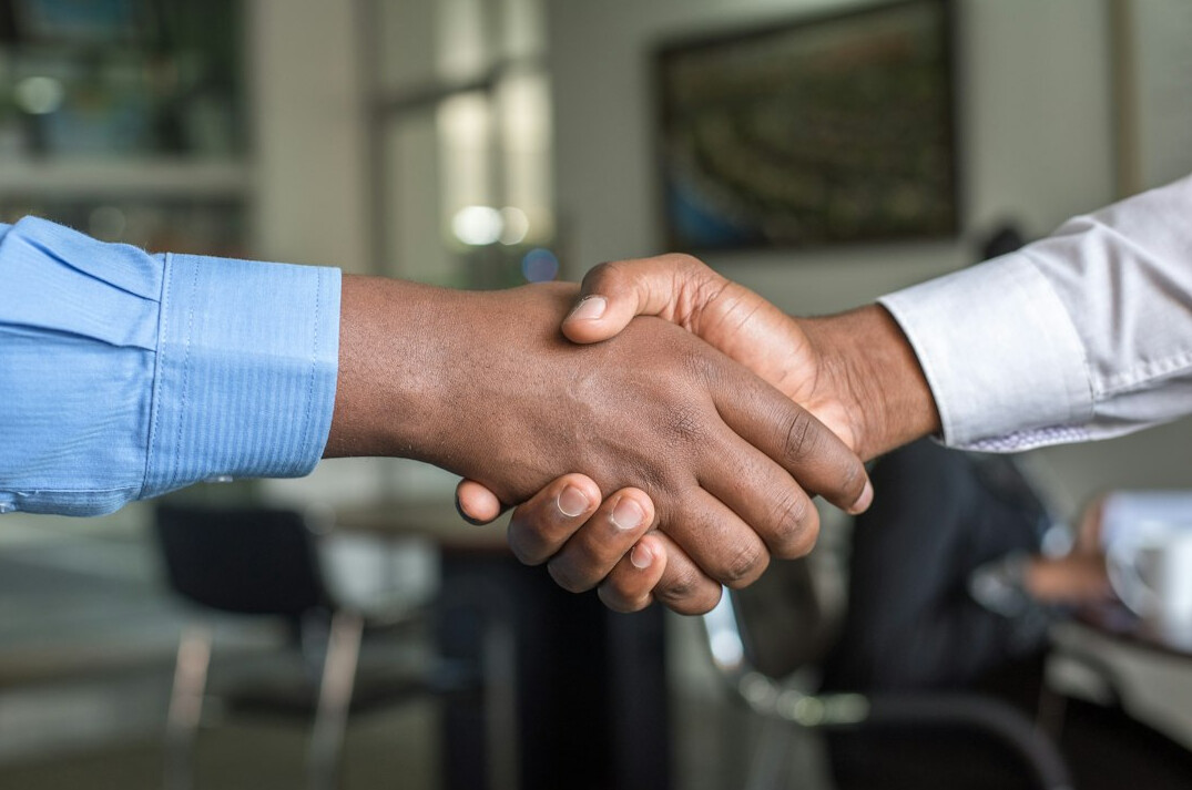 men shaking hands after meeting