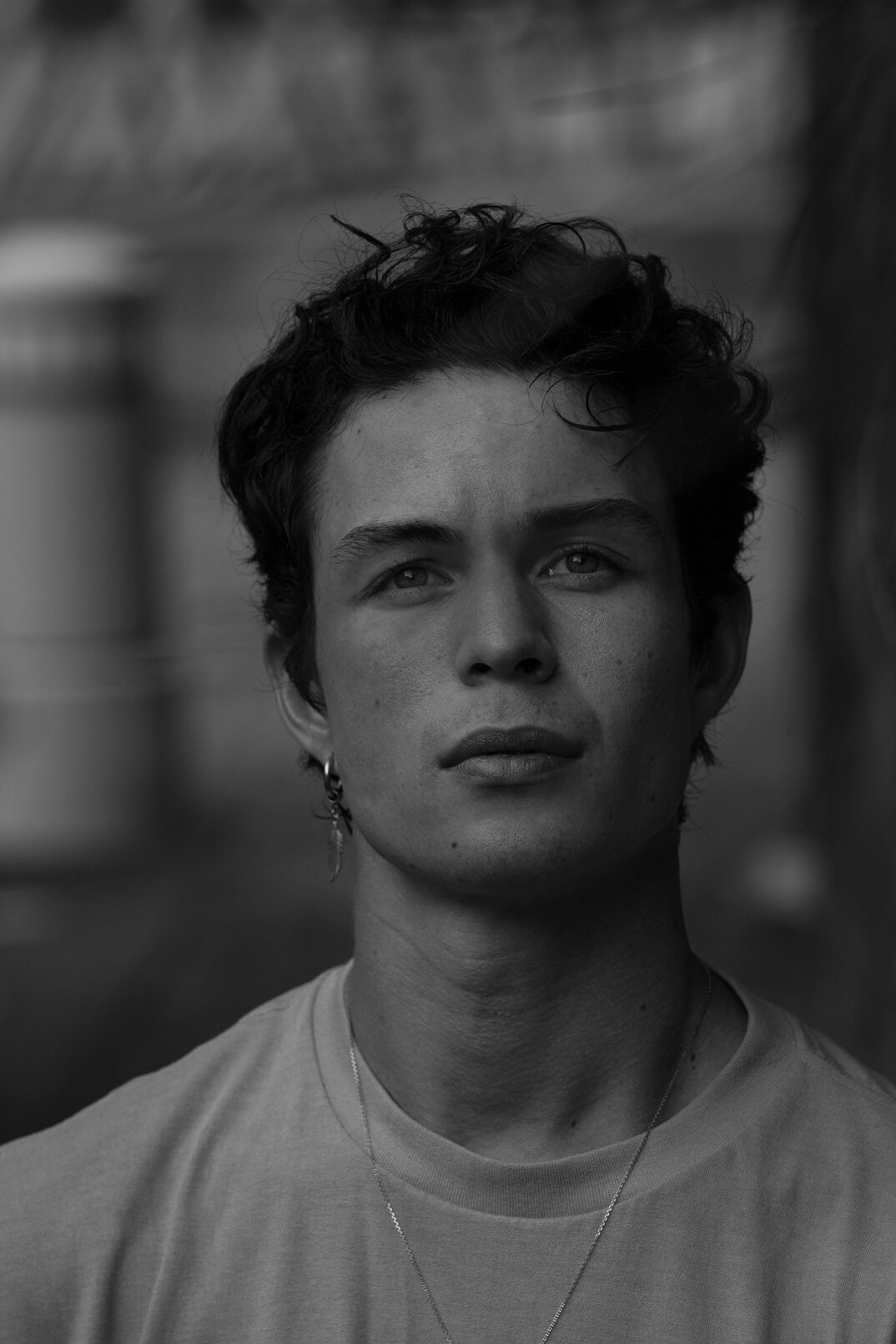 Portrait of a young man in a shirt looking at the camera